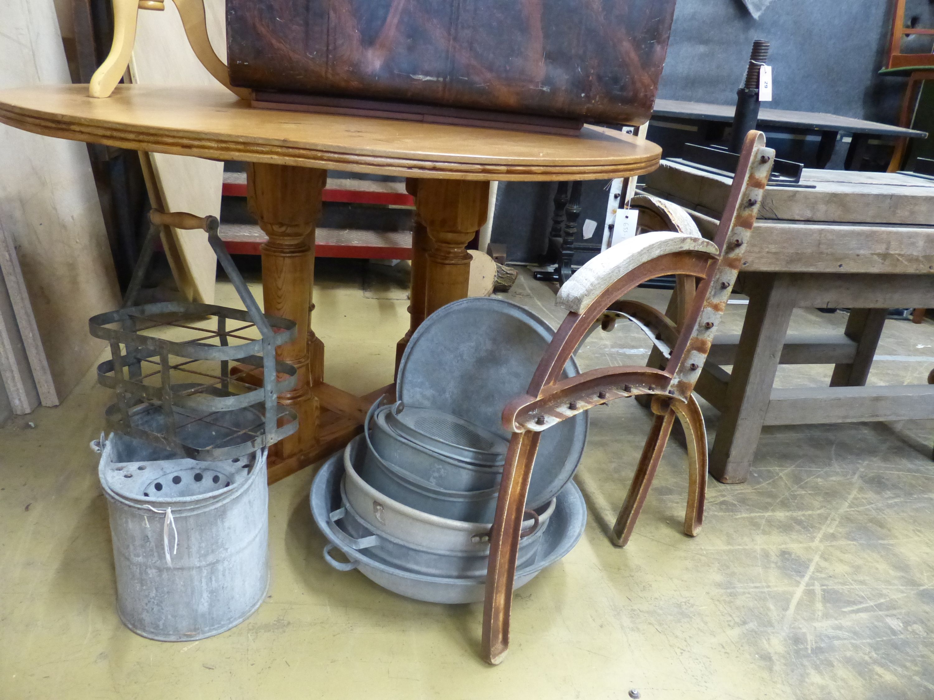 A pair of cast iron bench ends and assorted galvanised metal items
